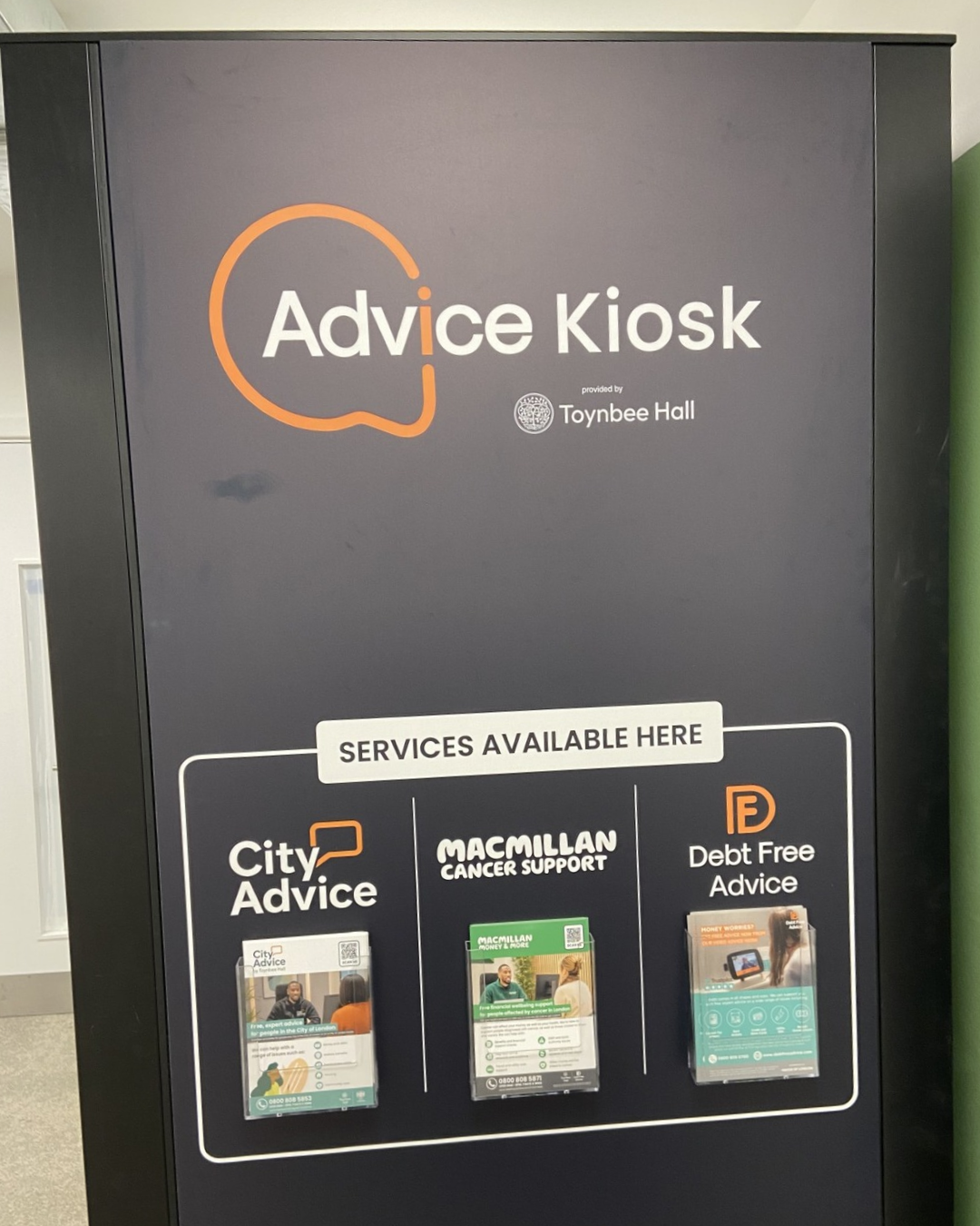 The side view of the City Advice Kiosk in Artizan Street Library with leaflets explaining services on the kiosk booth