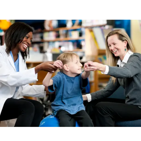 SEND child with parent and practitioner in a school setting